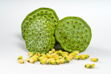 Fresh lotus seeds on a simple background