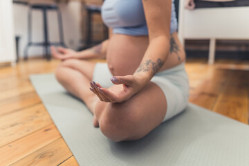 Fototapeta na wymiar pregnant woman meditating at home. High quality photo