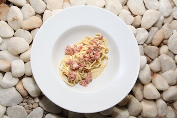 Spaghetti and sausage close up table view