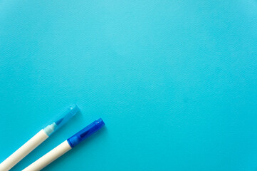 The creative concept of creativity is empty. Two felt-tip pens blue and blue lie off the edge of...