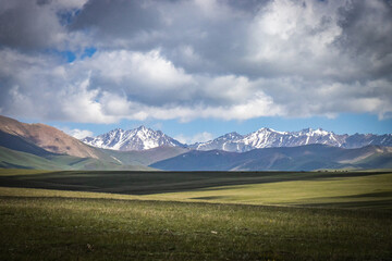 Fototapeta premium mountain landscape in kyrgyzstan, central asia, clouds, summer pasture