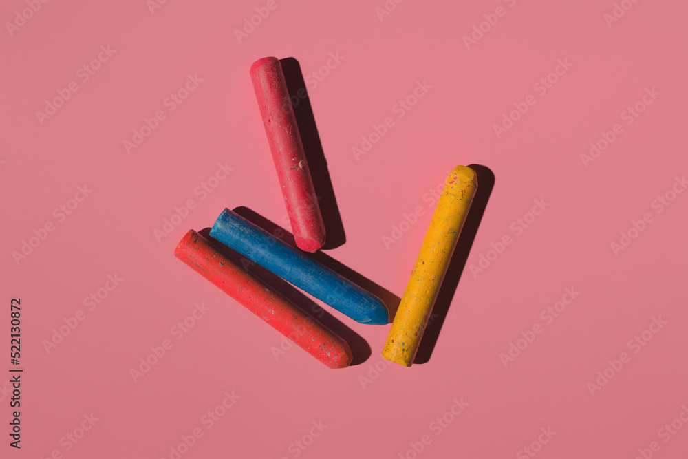 Canvas Prints colored crayons on a pink background in hard light