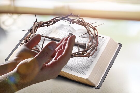 Human pray from god blessing to hands praying to god with the bible. Christian life crisis prayer to god.