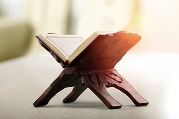 Quran holy book of Muslims in the mosque on a wooden stand
