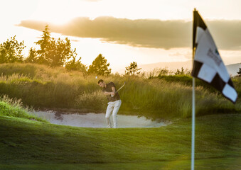 Golfer Hits From Sand Trap