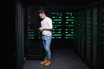 Engineer verifying information from device with system settings