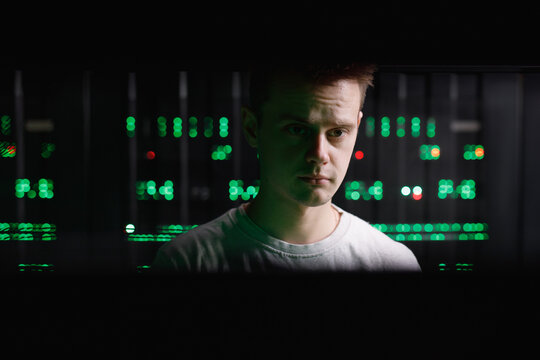 Male specialist giving careful consideration to computer hardware 