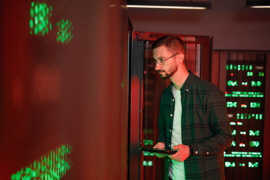 Specialist observing breakage of software in control room 