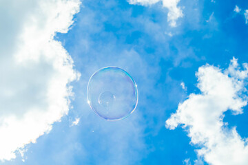 Soap bubble with the reflection of buildings inside.