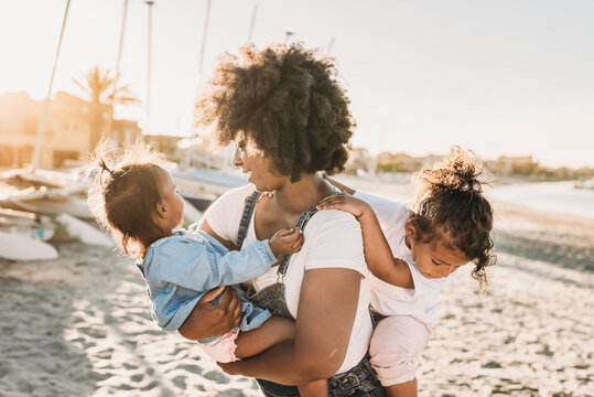 Mother and daughters at beach
