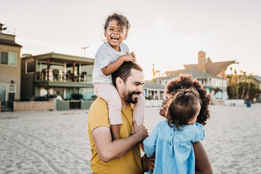 Family laughing at beach