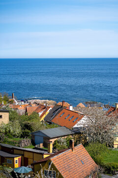 Rooftops across Gudhjem, view of the Baltic Sea