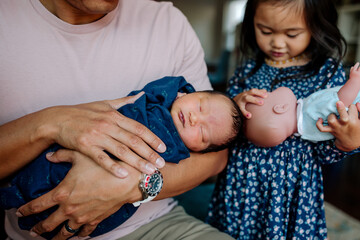 Newborn baby with big sister