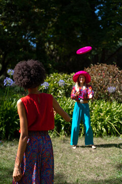 Anonymous friends playing in the park 