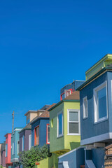 Fototapeta na wymiar Colorful row of houses against the blue sky at San Francisco, California