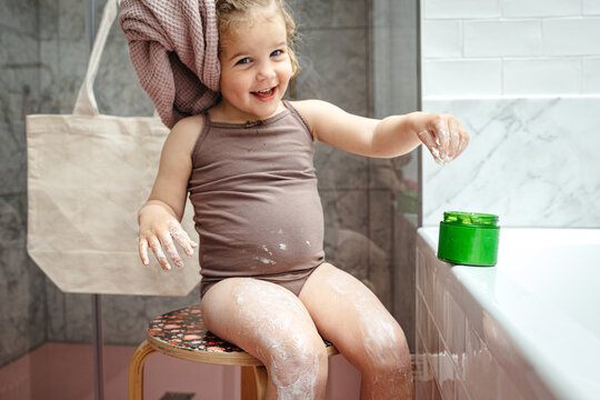 Girl messing around with body butter