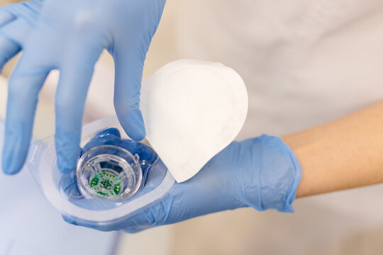 Medical worker unpacking nozzle of RF therapy