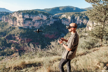 Guy experiencing virtual reality and launching drone