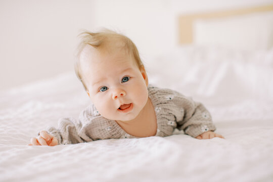 Portrait Of Cute Crawling Baby On bed