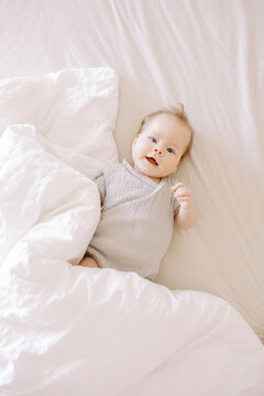 Cute Baby With White Blanket