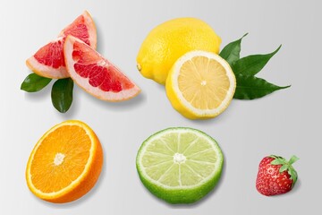Fototapeta na wymiar Tropical fruit lemon orange lime strawberry slice on the desk