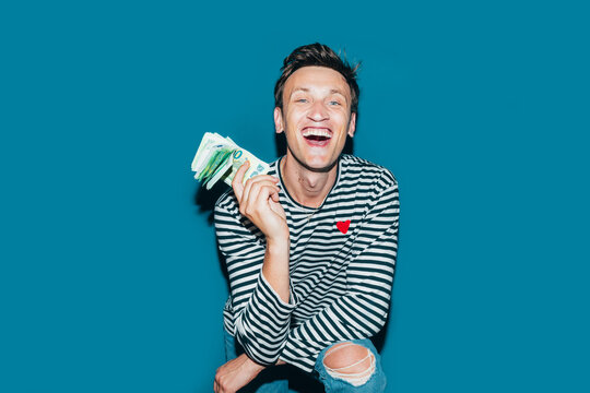 Happy Man Holding Money 