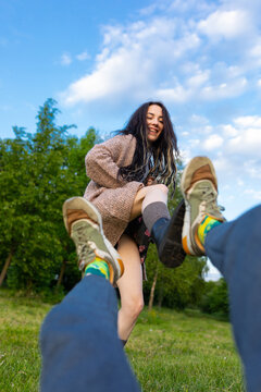 model and photographer shoving feet