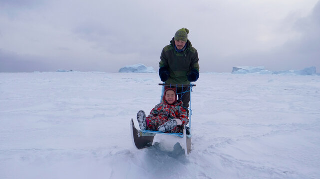 Greenland Arctic: Sea-ice Way Of Life Inuit Family Push Sled Or Sledge