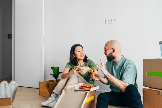 Man and Woman Eating Pizza 