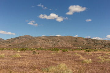 A view on the desert with mountains and sky