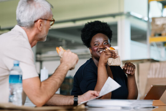 Colleagues Eating Sandwiches at Work