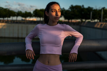 Self-assured Sportswoman relaxing after work out