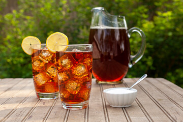 Iced Tea Glasses with Pitcher and Sugar Bowl on Picnic Table