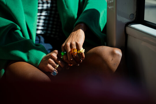 Fancy anonymous man by bus with flashy rings