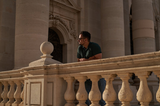 A man standing at a historical site