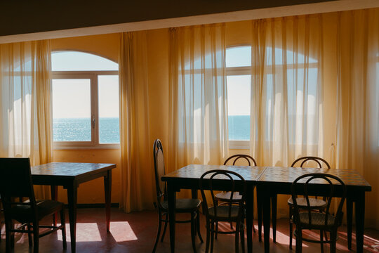 Empty dining room in hotel with warm light 