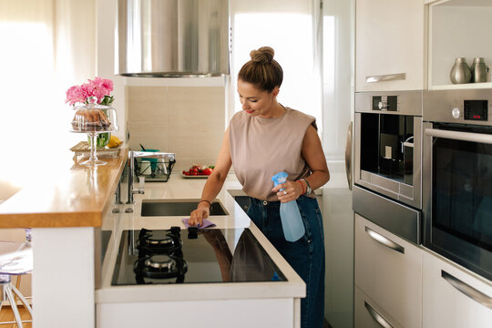 Caucasian Woman Cleaning Kitchen Counter