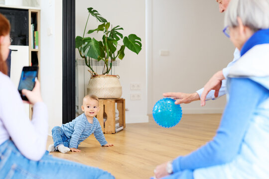 Family playing with child