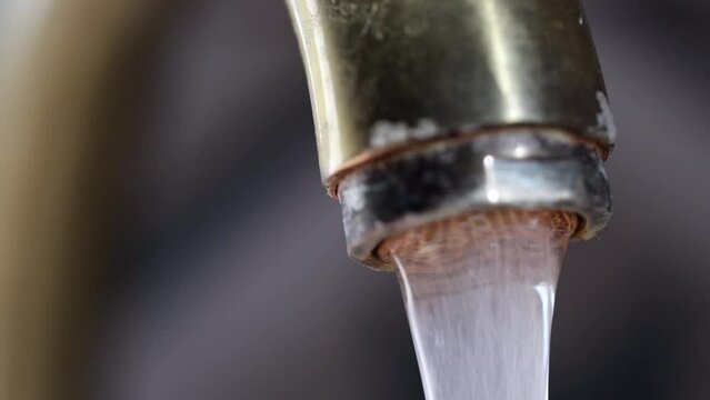 Jet Water Tap Stream Pours. Turning Off The Tap Water. Water Dripping From Tap. The Vintage Bronze Faucet In The Kitchen. Macro. Close-up. 60 FPS, 4k, ProRes