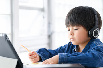 Boy teaches online class on a tablet