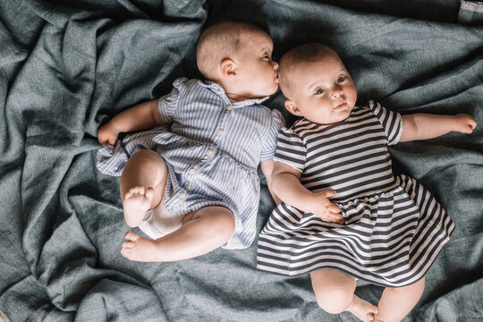 Twins Lying In Bed