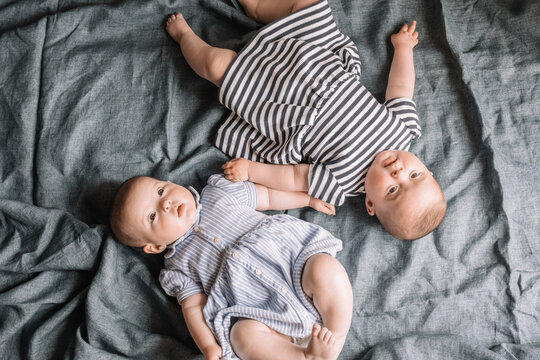 Twins Lying In Bed