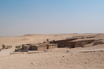 Sandy landscape in the desert in Cairo in front of the famous Egyptian pyramids