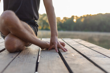 yogi practicing asana gomukhasana close up