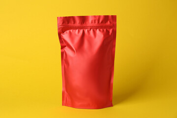 One blank foil package on yellow background