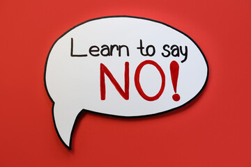 Paper speech bubble with phrase Learn to Say No on red background, top view