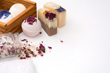 Beautiful natural handmade salt, bomb and soap with roses on a white background