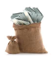 Burlap bags with many dollar banknotes on white background
