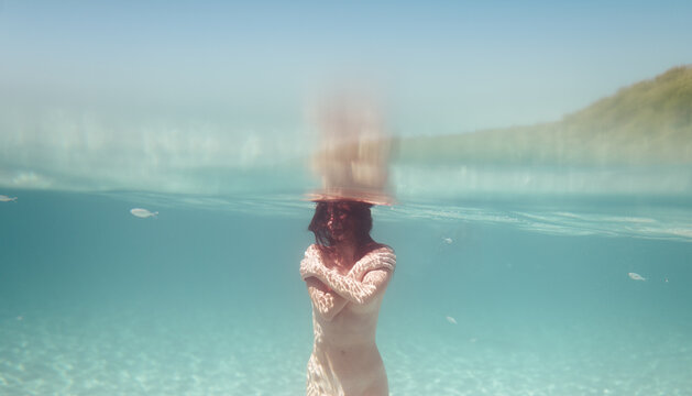 Idyllic underwater portrait of woman inside tropical beach sea