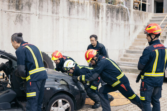 Firefighters working in a parking lot
